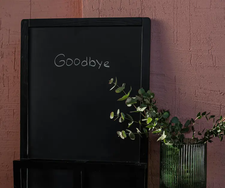 A chalkboard with 'Goodbye' written on it.