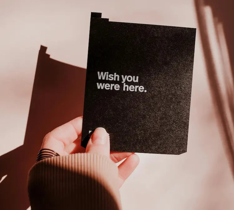 A note with 'Wish you were her' written on it.
