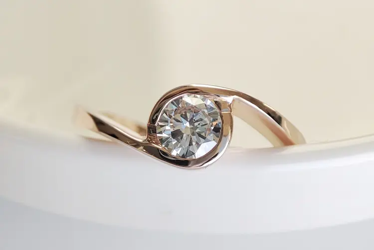 A ring with a colorless memorial diamond.