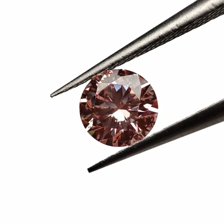 Pink round cremation diamond.