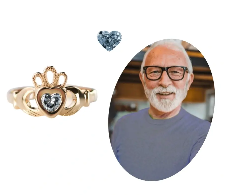 A Claddagh ring next to a heart-cut blue diamond and a picture of an old man.