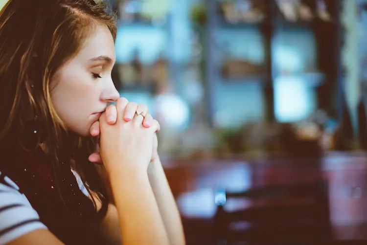 A girl praying.