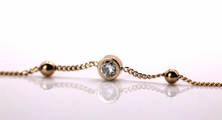 A round colorless diamond in a bracelet.