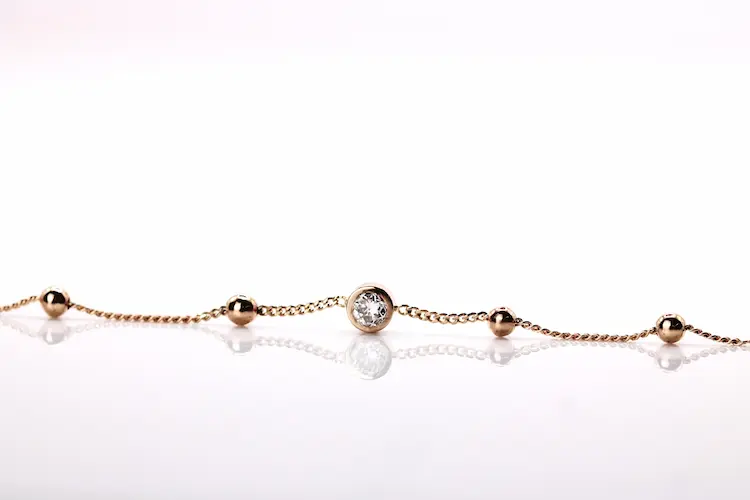 Colorless round memorial diamond in a bracelet.