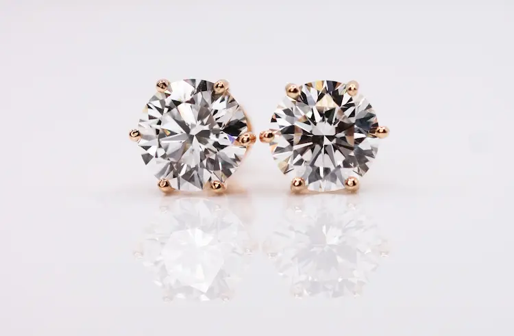 Colorless round cut memorial diamond earrings.