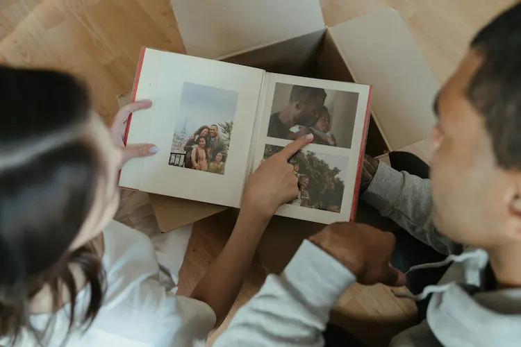 A couple looking through photo albums.